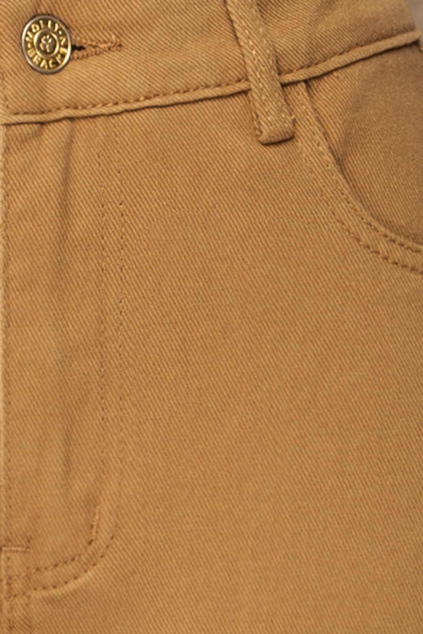 Close-up of Guntur Straight Leg Caramel Denim Pants at la petite garçonne