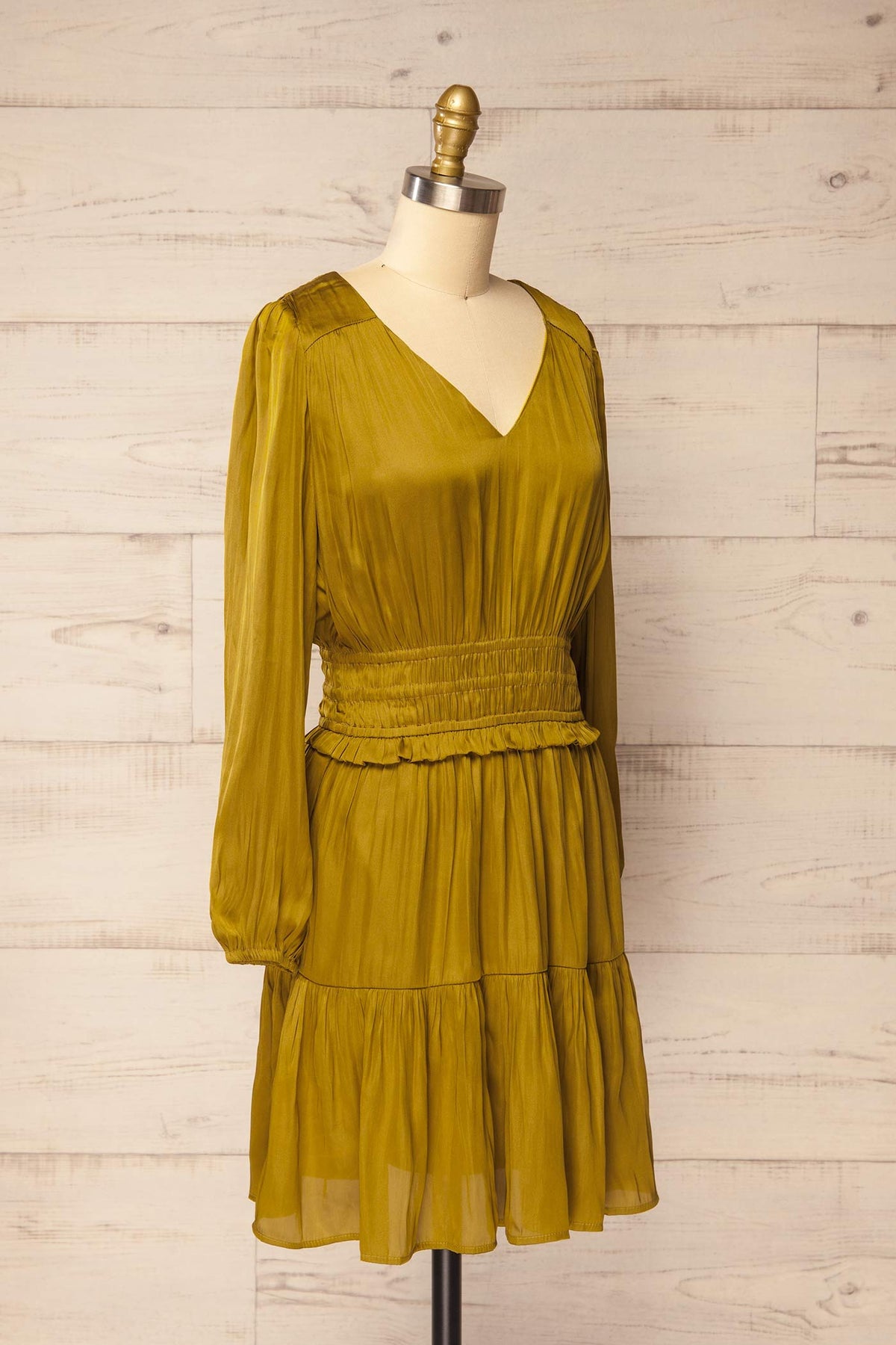 side view of Harrisburg Chartreuse Long Sleeve Satin Smocked Mini Dress at La petite garçonne