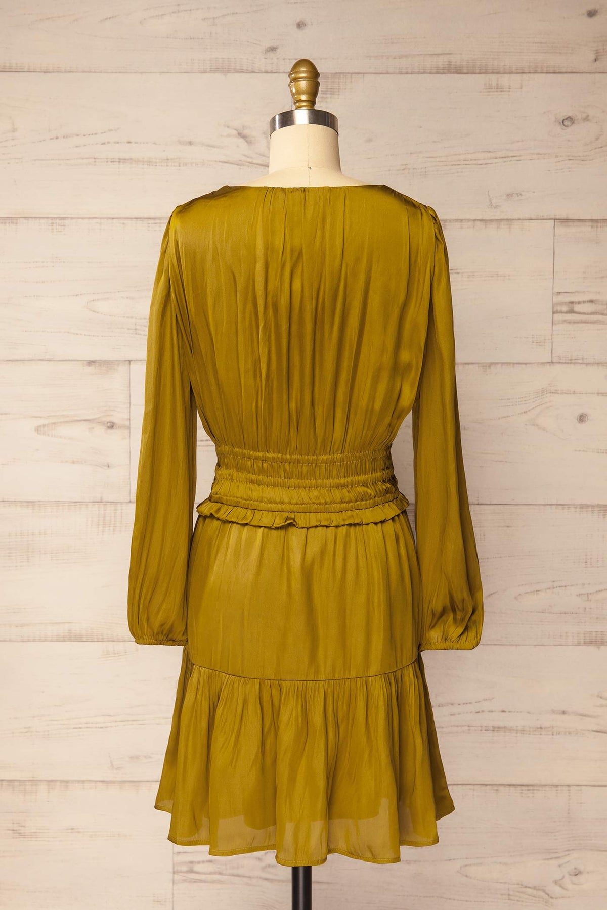 back view of Harrisburg Chartreuse Long Sleeve Satin Smocked Mini Dress at La petite garçonne