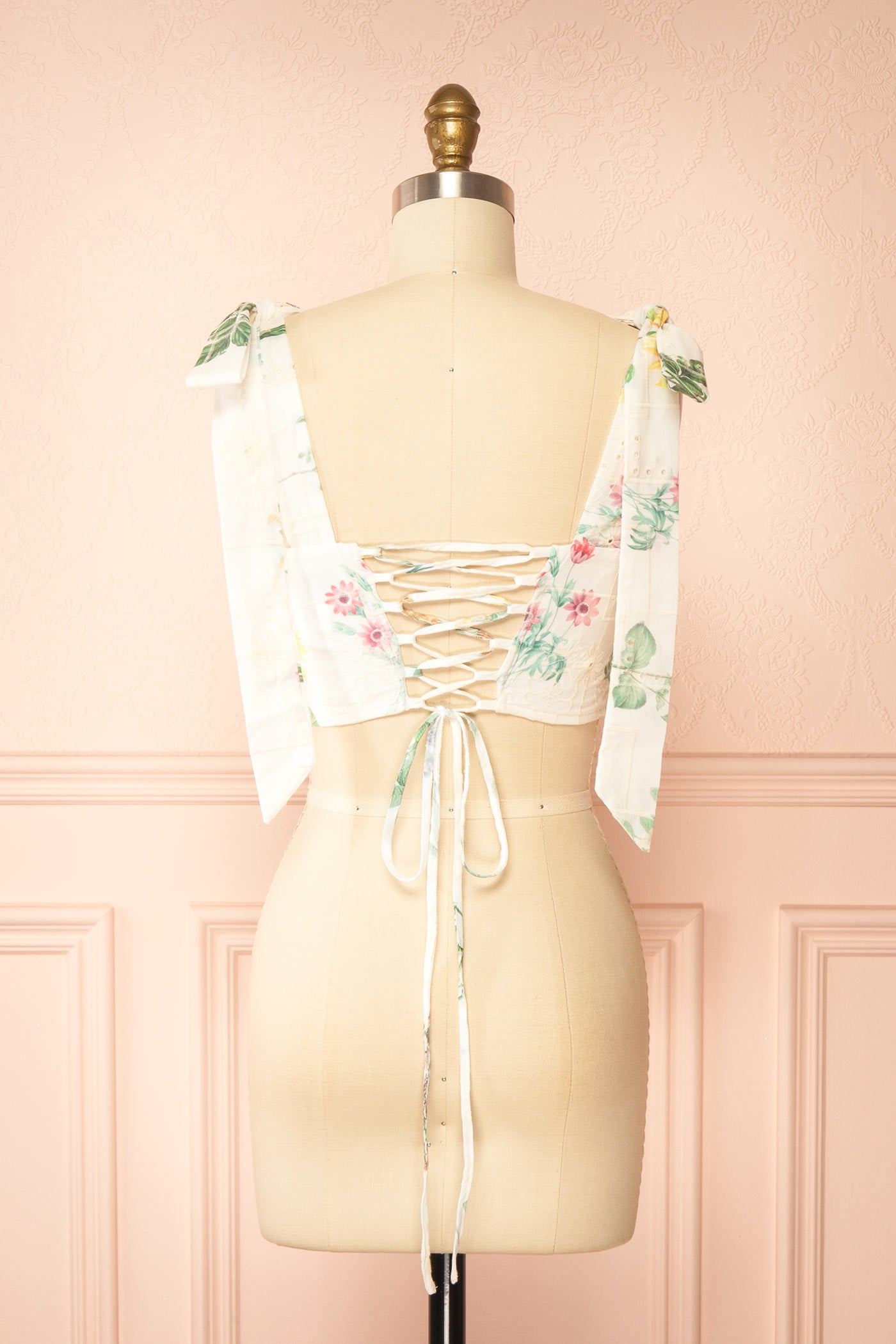 Back view of Hassan Embroidered Eyelet Floral Lace up Back White Crop Top at la boutique 1861
