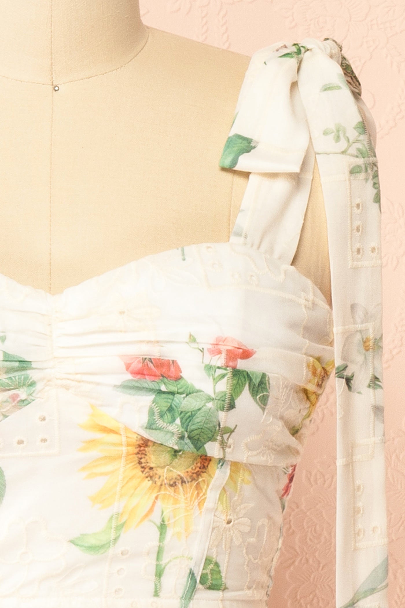 Close up view of Hassan Embroidered Eyelet Floral Lace up Back White Crop Top at la boutique 1861