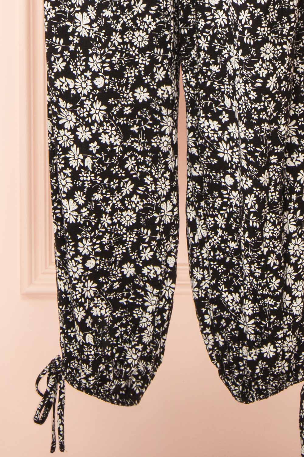 Hecate Black Jumpsuit w/ White Floral Motif | Boutique 1861 bottom