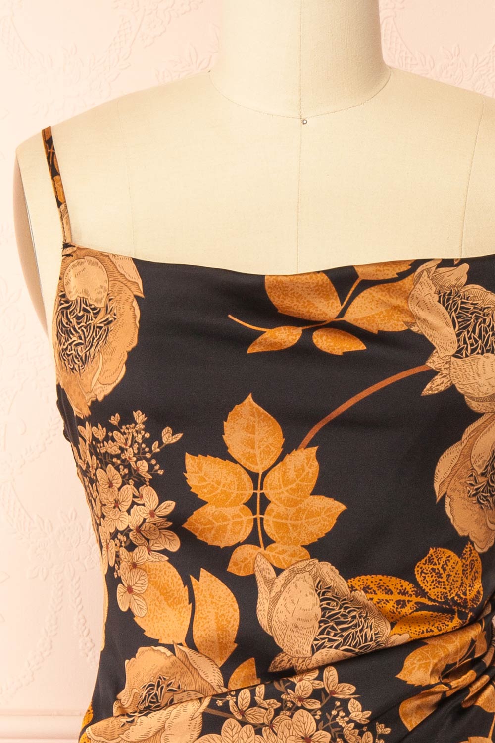 front of sewing mannequin wearing Hinaya Black Floral Cowl Neck Satin Midi Slip Dress from Boutique 1861