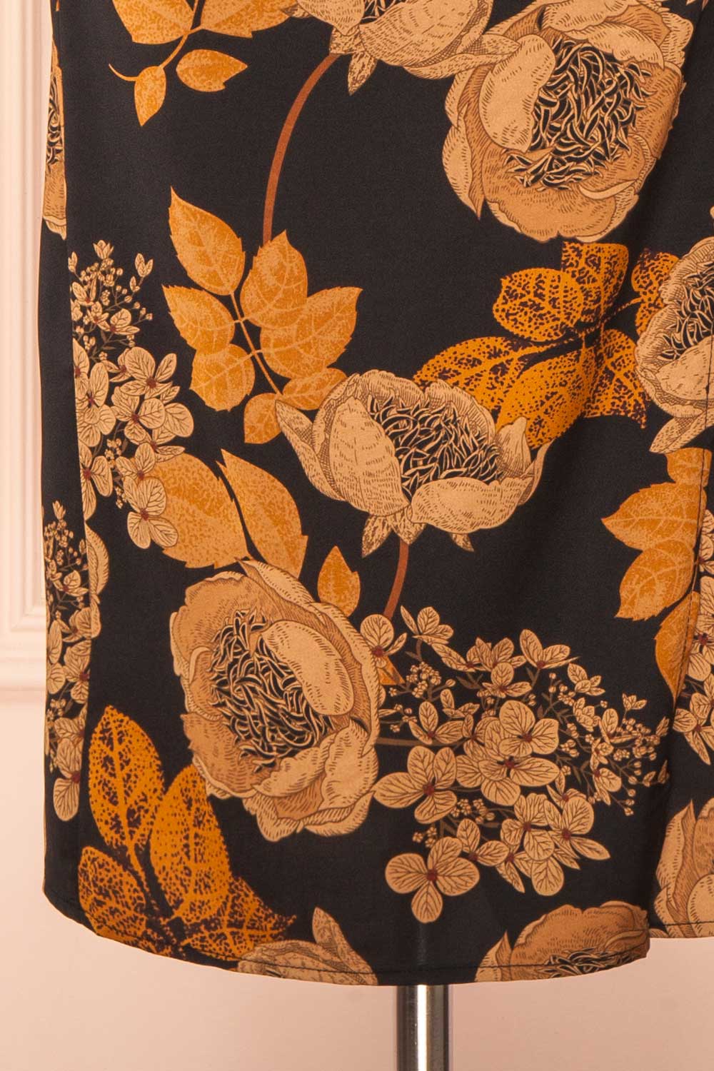 bottom of sewing mannequin wearing Hinaya Black Floral Cowl Neck Satin Midi Slip Dress from Boutique 1861