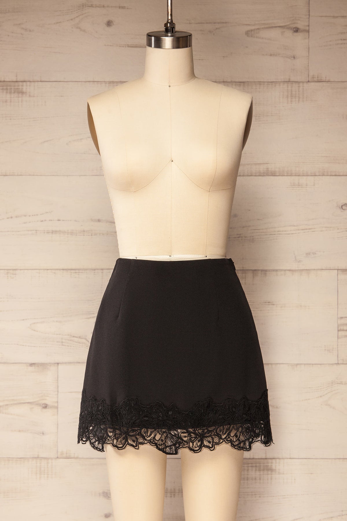 front view of Imilda Black Lace-Trim Mini Skirt with Built-In Shorts at La petite garçonne