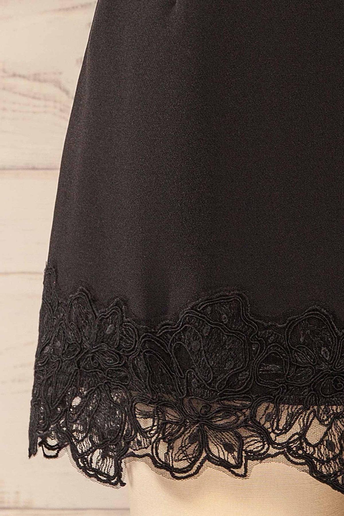 fabric view of Imilda Black Lace-Trim Mini Skirt with Built-In Shorts at La petite garçonne