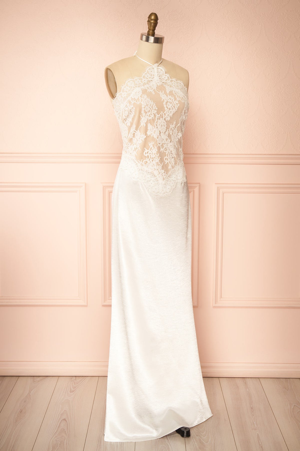 side view of Irimia White Maxi Satin Halter Dress with Open Back at Boudoir 1861