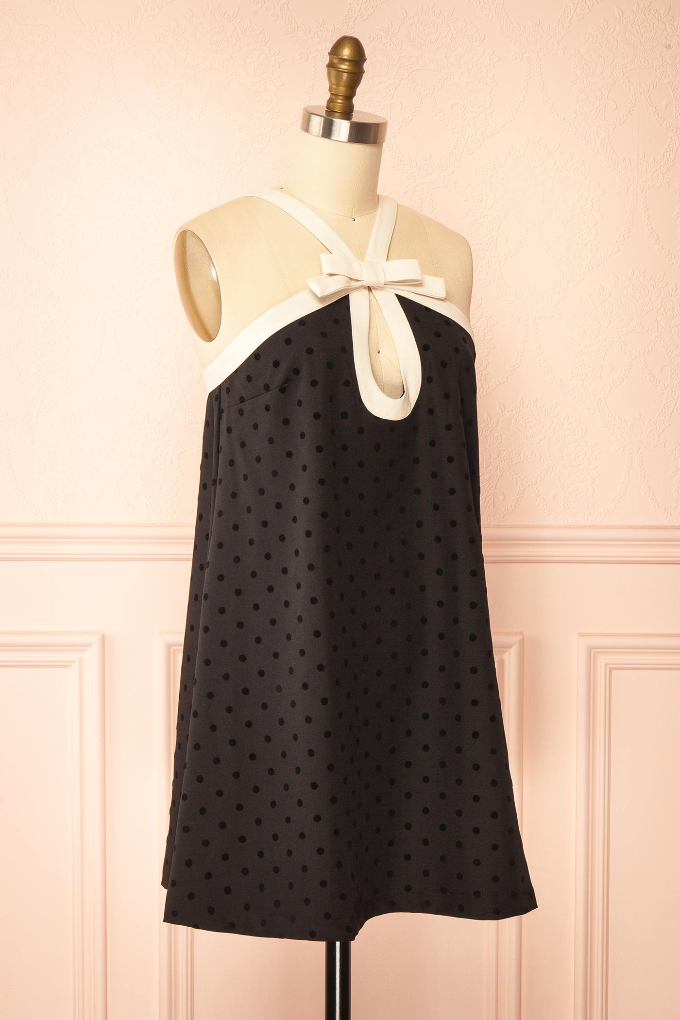 Isalda Black Polka Dot Mini Dress with White Contrast Bow Detail | Boutique 1861 side