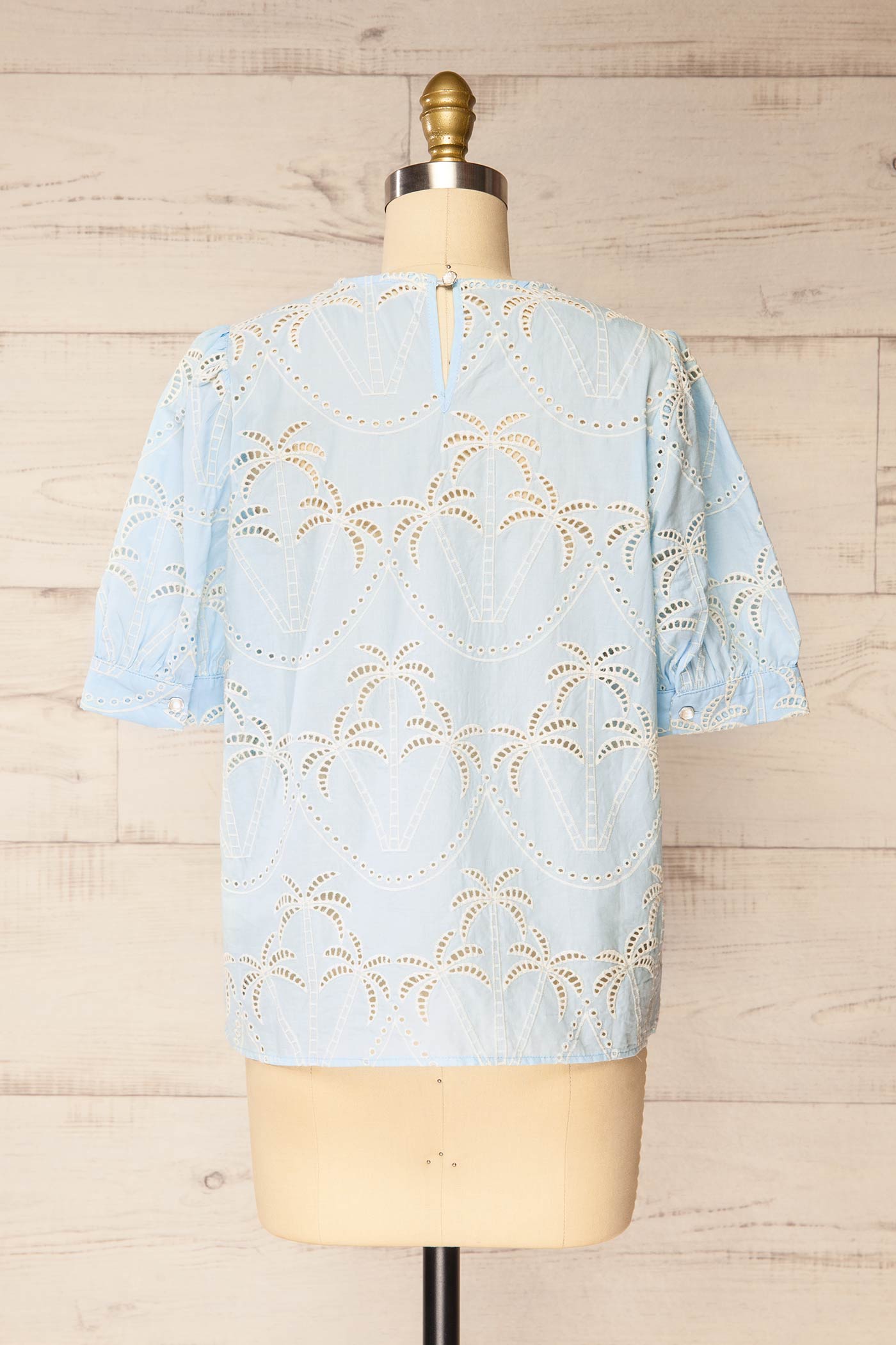 Backview of Jadra Blue Blouse with palm design at la petite garçonne