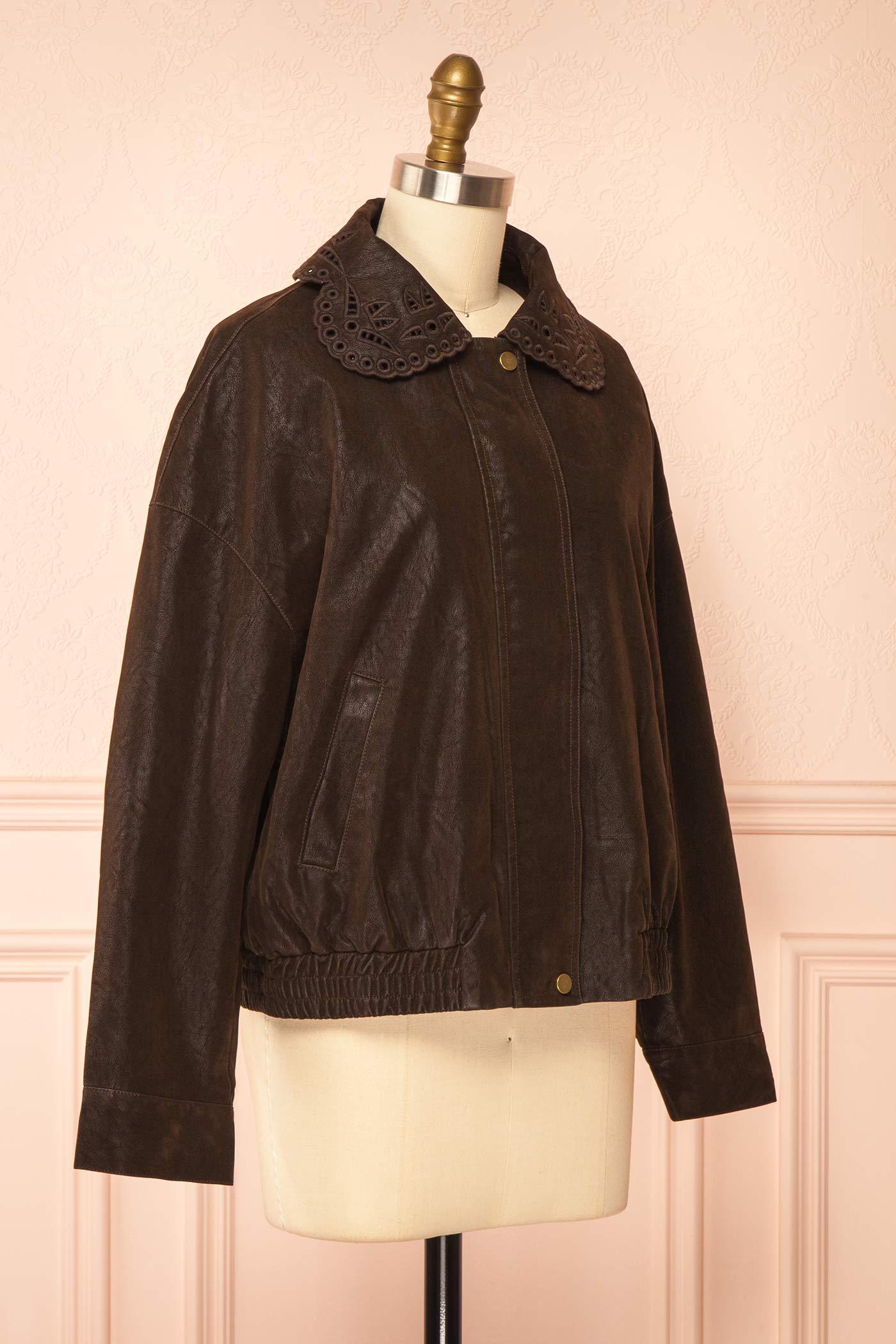 side view of Jeremia Brown Faux Leather Embroidered Collar Bomber Jacket at Boutique 1861