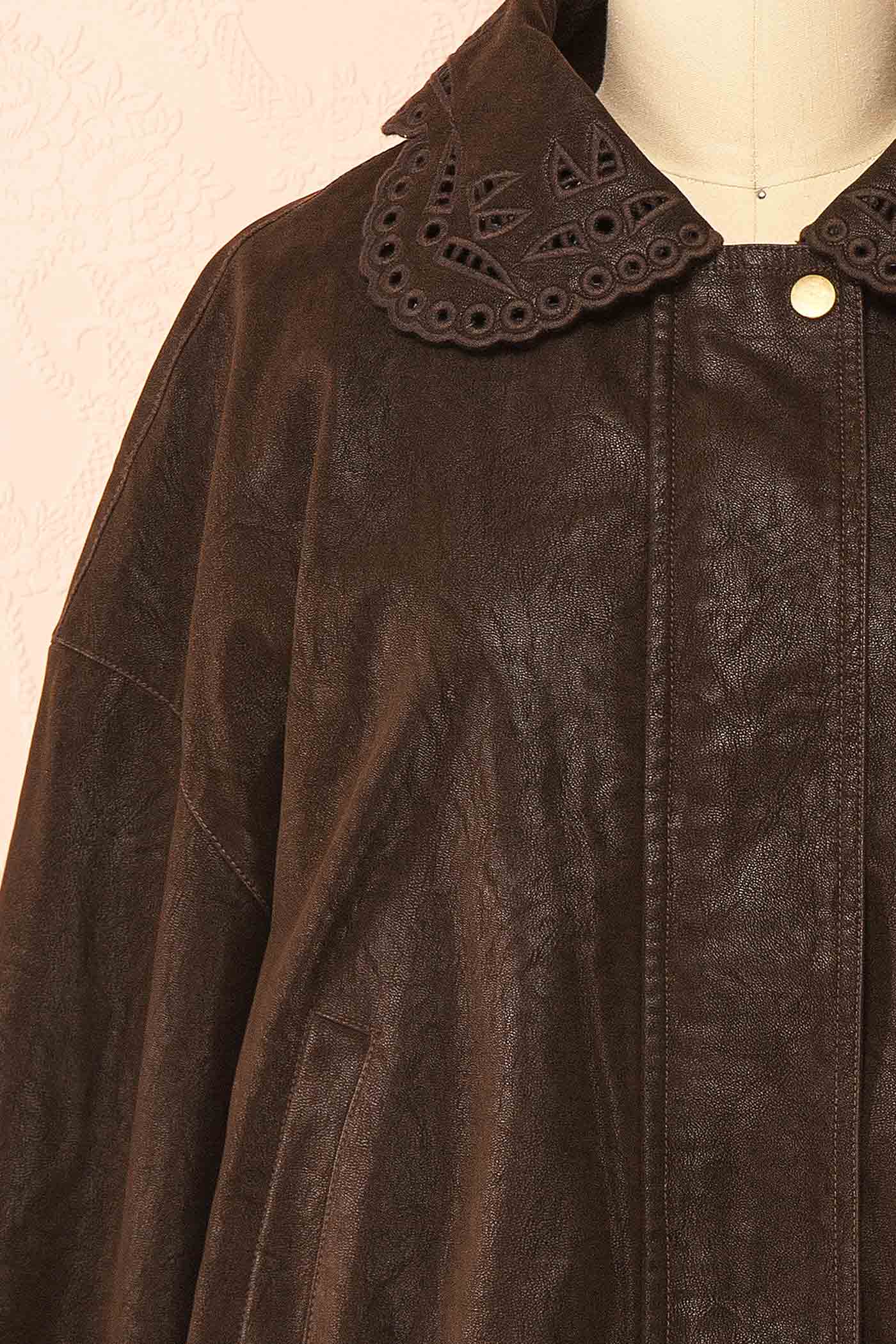 fabric view of Jeremia Brown Faux Leather Embroidered Collar Bomber Jacket at Boutique 1861