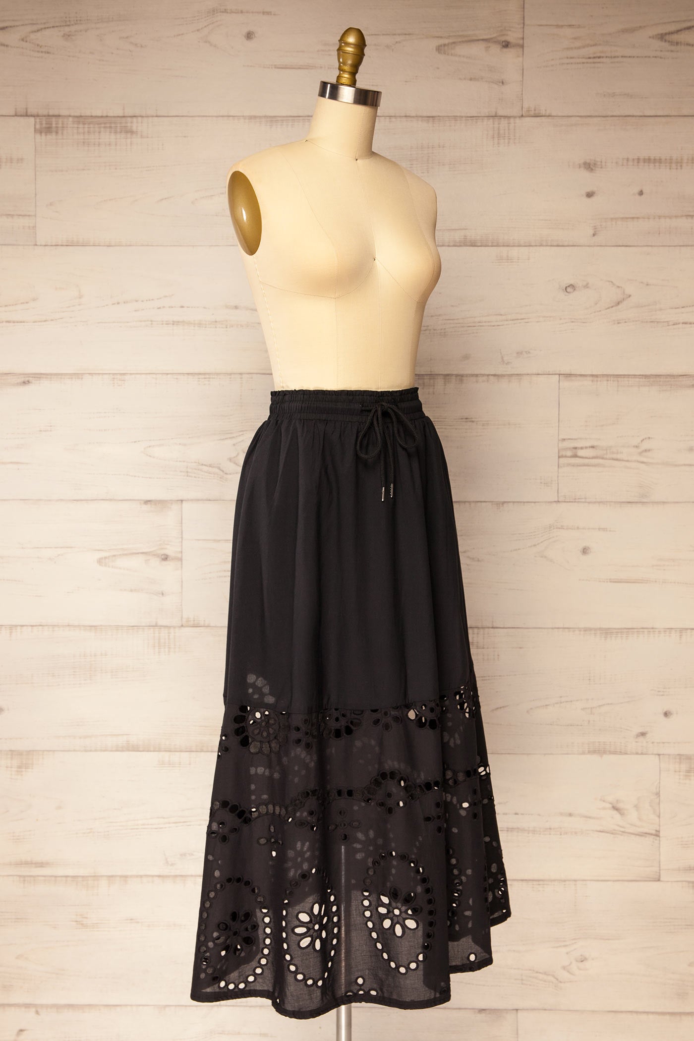 Sideview Jolene Black Midi Skirt with Eyelets and Pockets at la petite garçonne