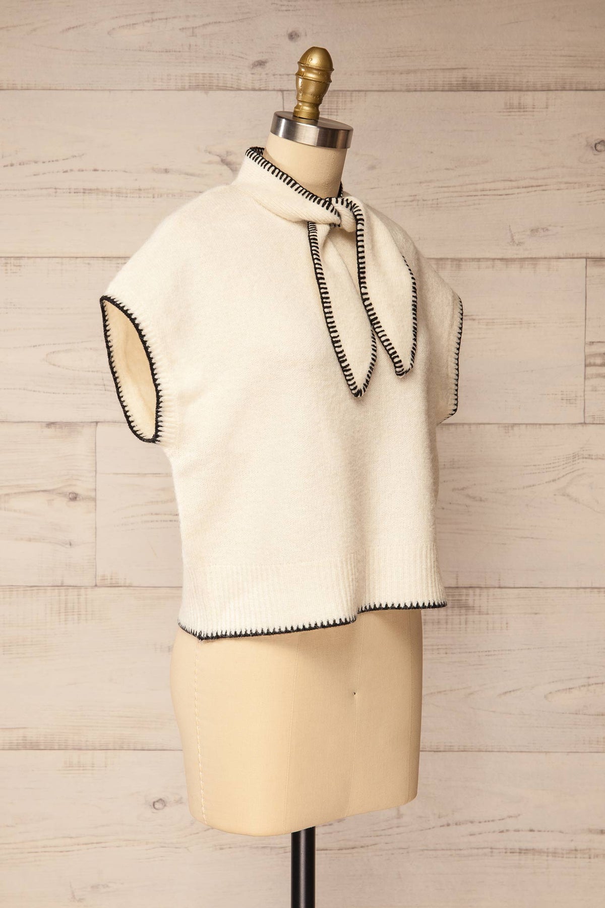 side view of Jutai Ivory Knit Sweater Vest with Tie Scarf at La petite garçonne