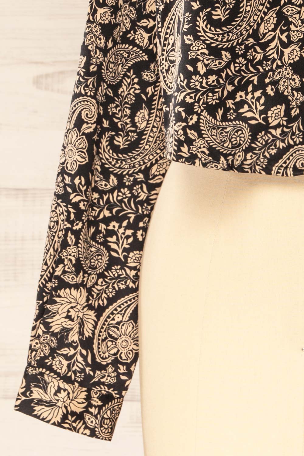 sleeve of sewing mannequin wearing Kalyan Cropped Paisley Print Shirt from La petite garçonne