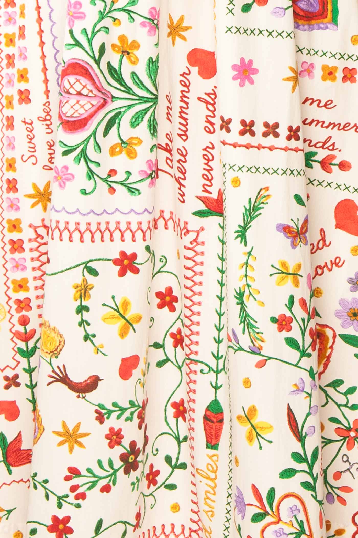 Close-up view Lauria White Folk-Art Floral Print Smocked Midi Dress at boutique 1861