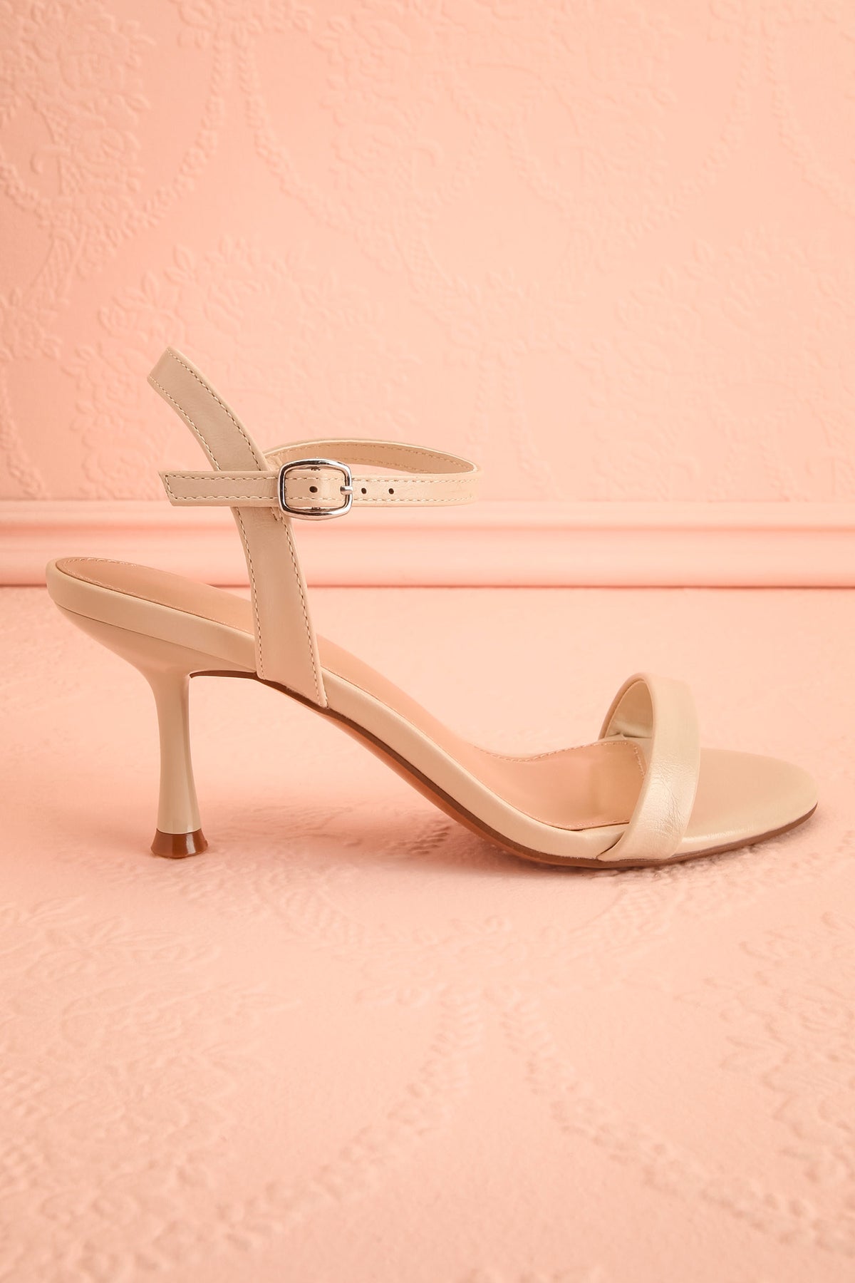 Side view of Liatris Gold Ankle Strap Kitten Heel Sandals at Boutique 1861 in Montreal