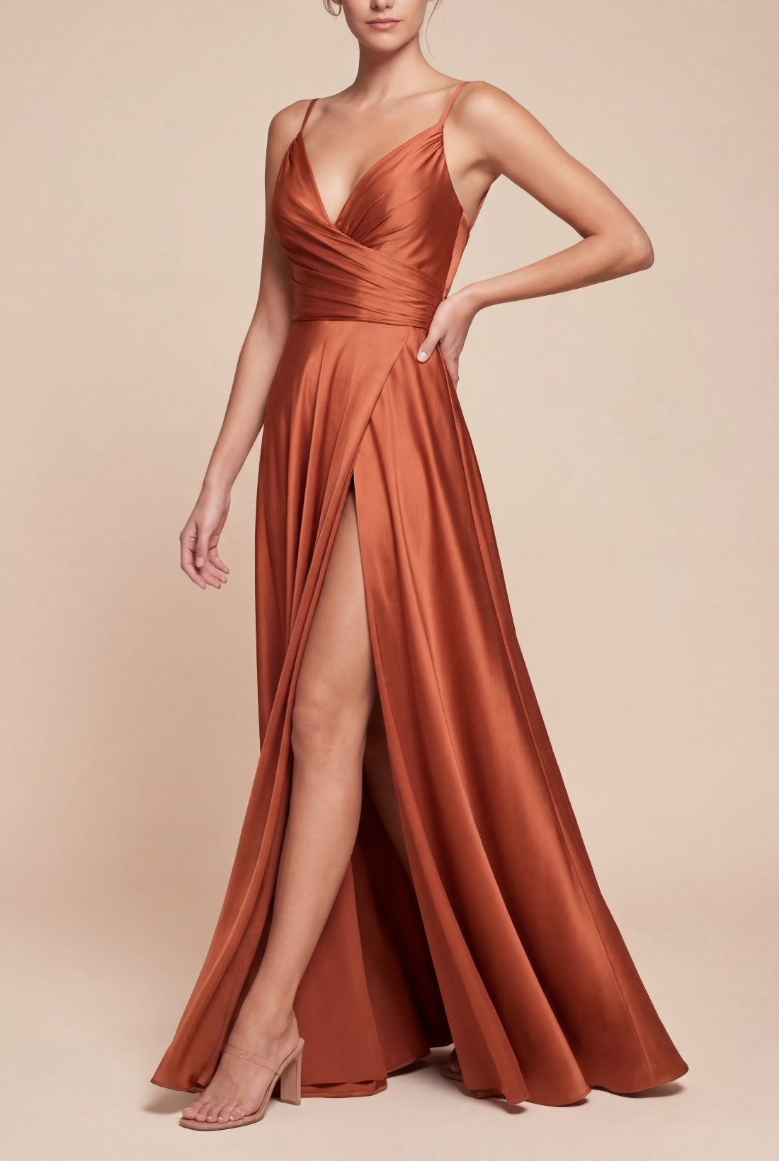 Profile of a woman wearing Lizza Rust Satin Maxi Dress with a Slit from Boudoir 1861 