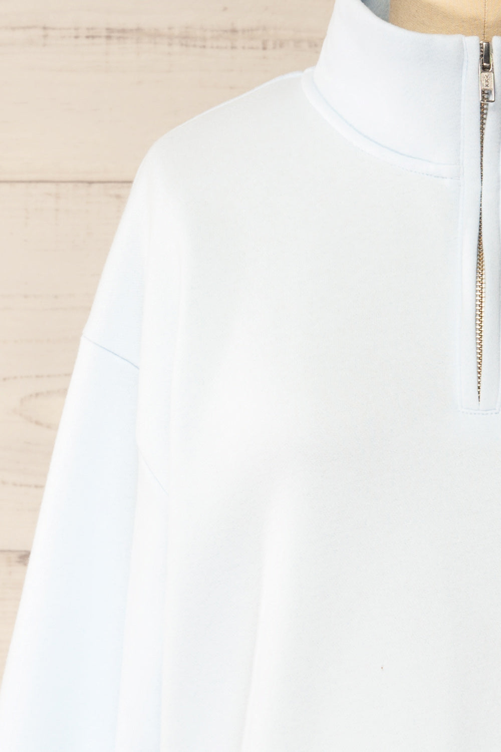 Madurai Light Blue Cropped Quarter-Zip Sweatshirt | La petite garçonne front