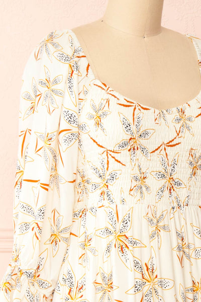 Maelis Short Ivory Floral Dress w/ 3/4 Sleeves | Boutique 1861 side close-up