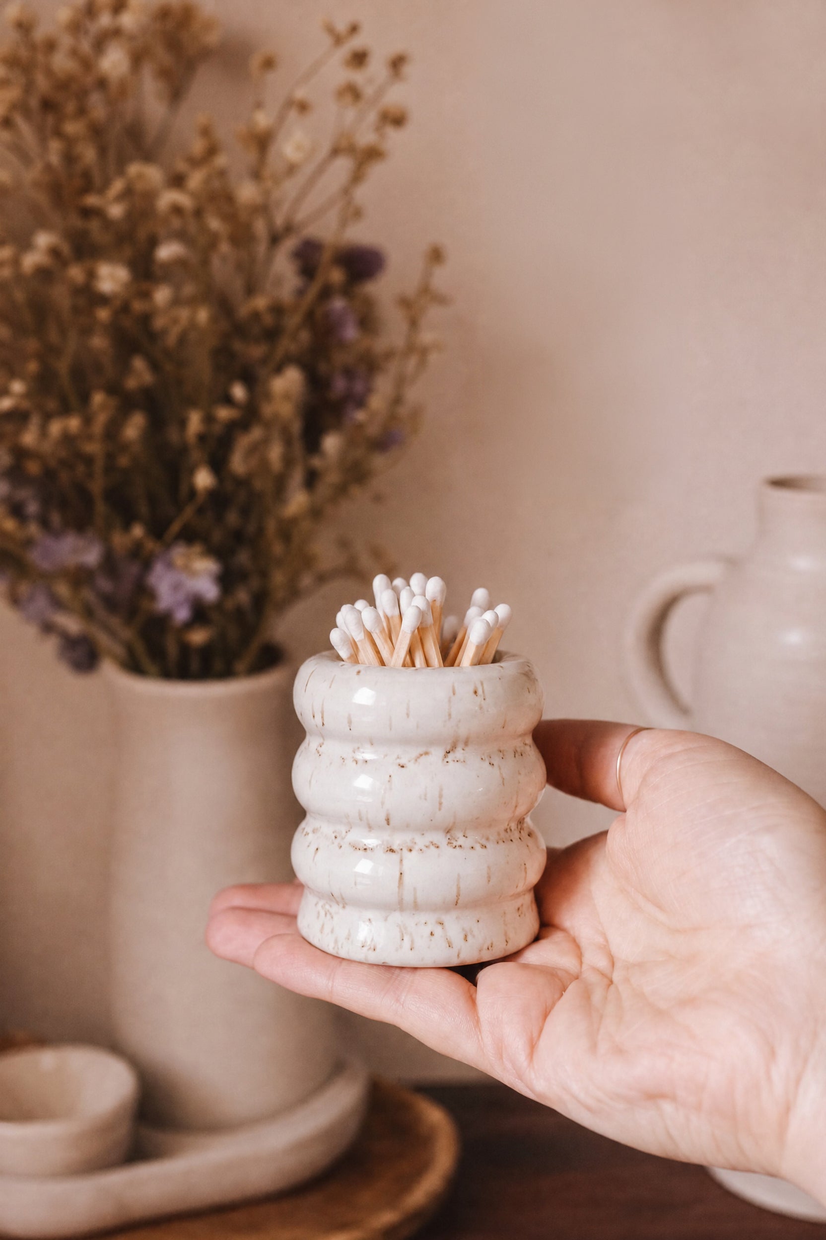 hand holding Wavy Ceramic Match Pot Dots from Maison garçonne