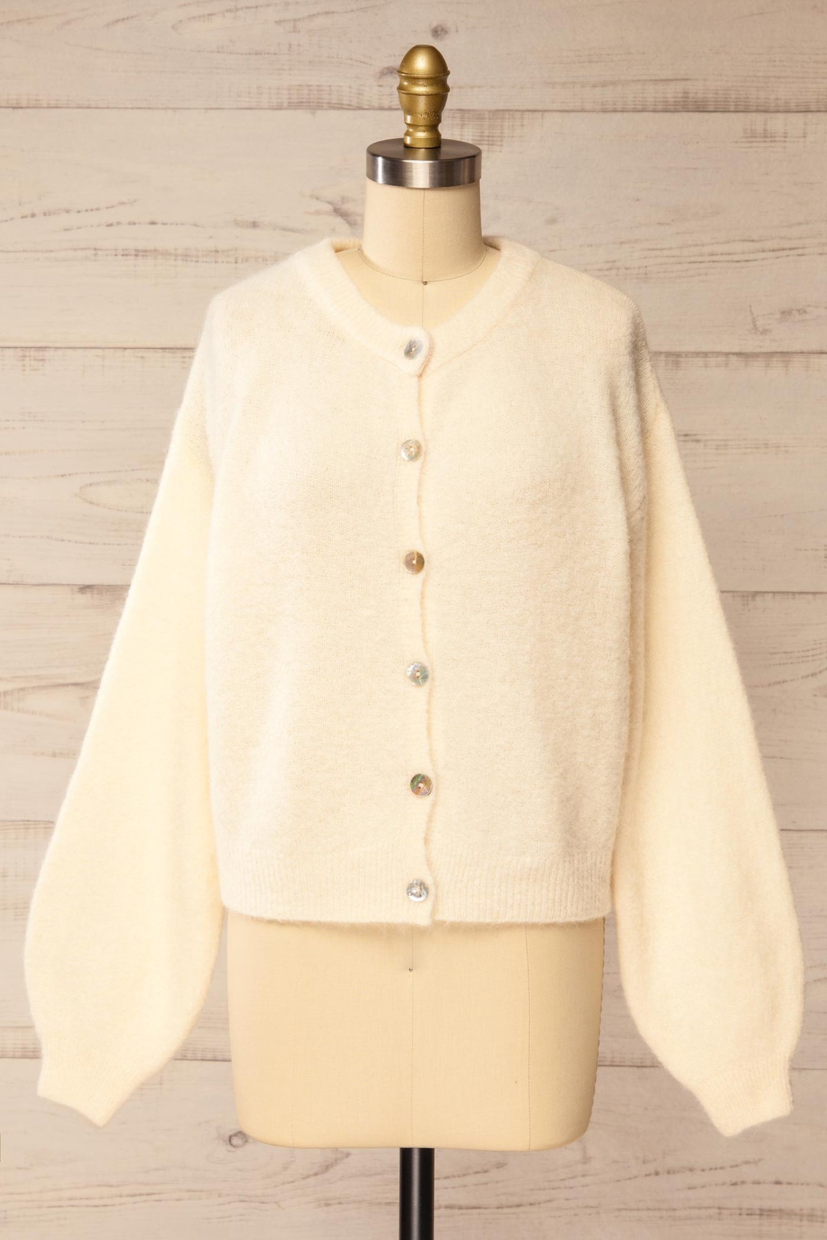 front view of Megumi Ivory Button-Front Knit Cardigan at La petite garçonne