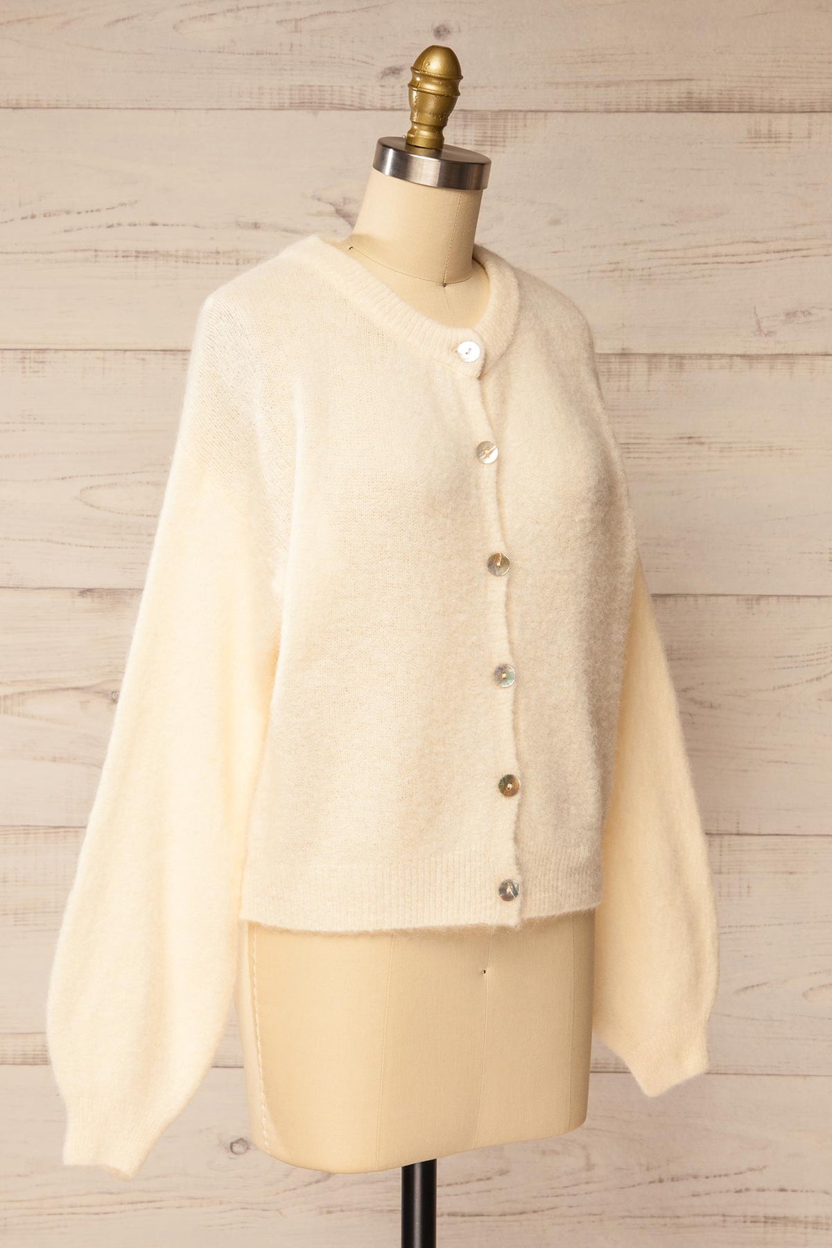 side view of Megumi Ivory Button-Front Knit Cardigan at La petite garçonne