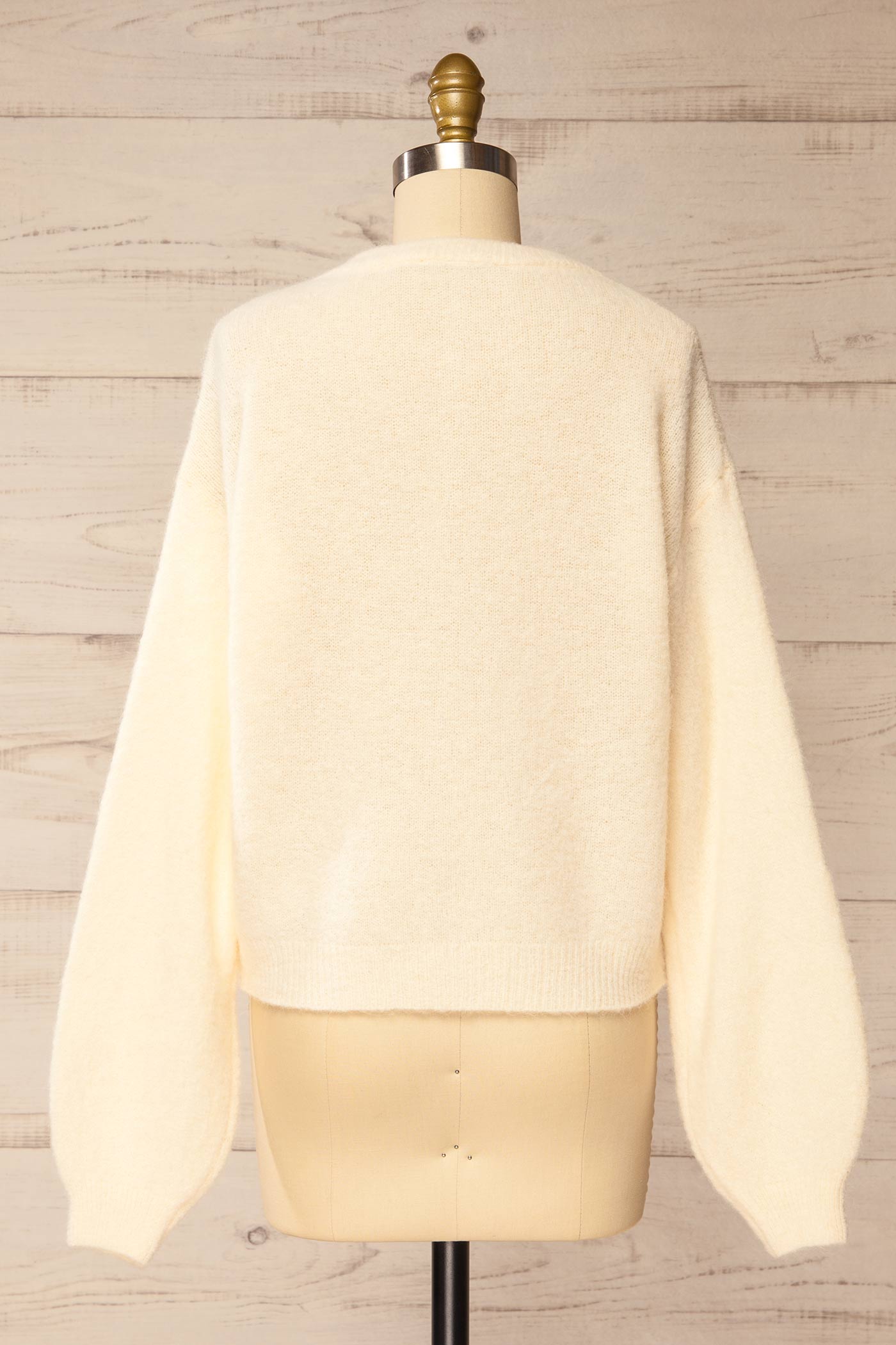 back view of Megumi Ivory Button-Front Knit Cardigan at La petite garçonne