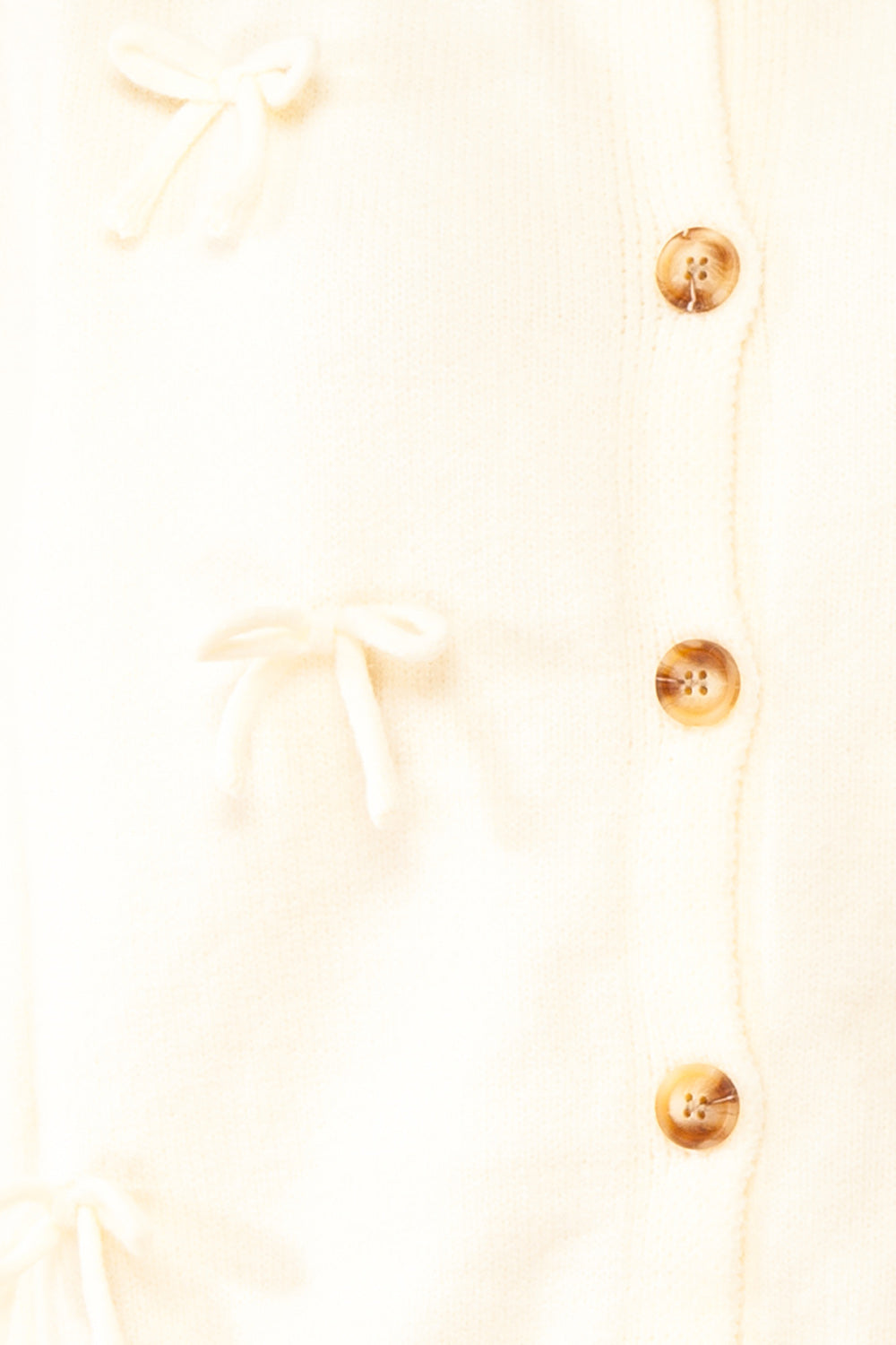 Minara Ivory Button-Down Cardigan w/ Bows | Boutique 1861  fabric 