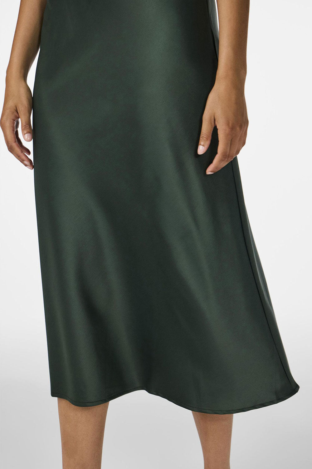person wearing Molokai Midi Emerald Satin Skirt from La petite garçonne front