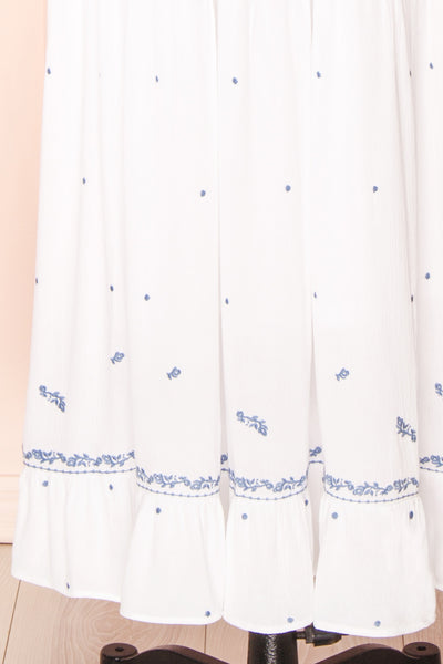 Monet White Maxi Dress w/ Blue Embroidery | Boutique 1861 bottom close-up