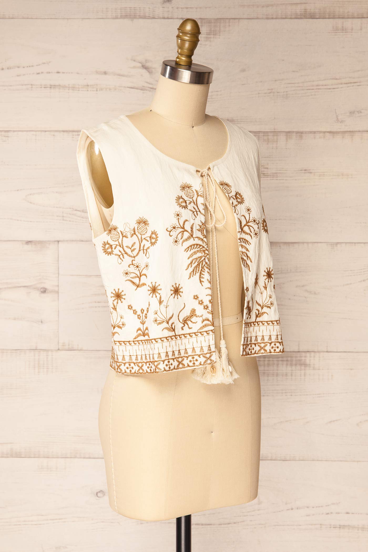 Sideview Nabha Embroidered Boho Tie-Front Ivory Top with Tassels at la petite garçonne