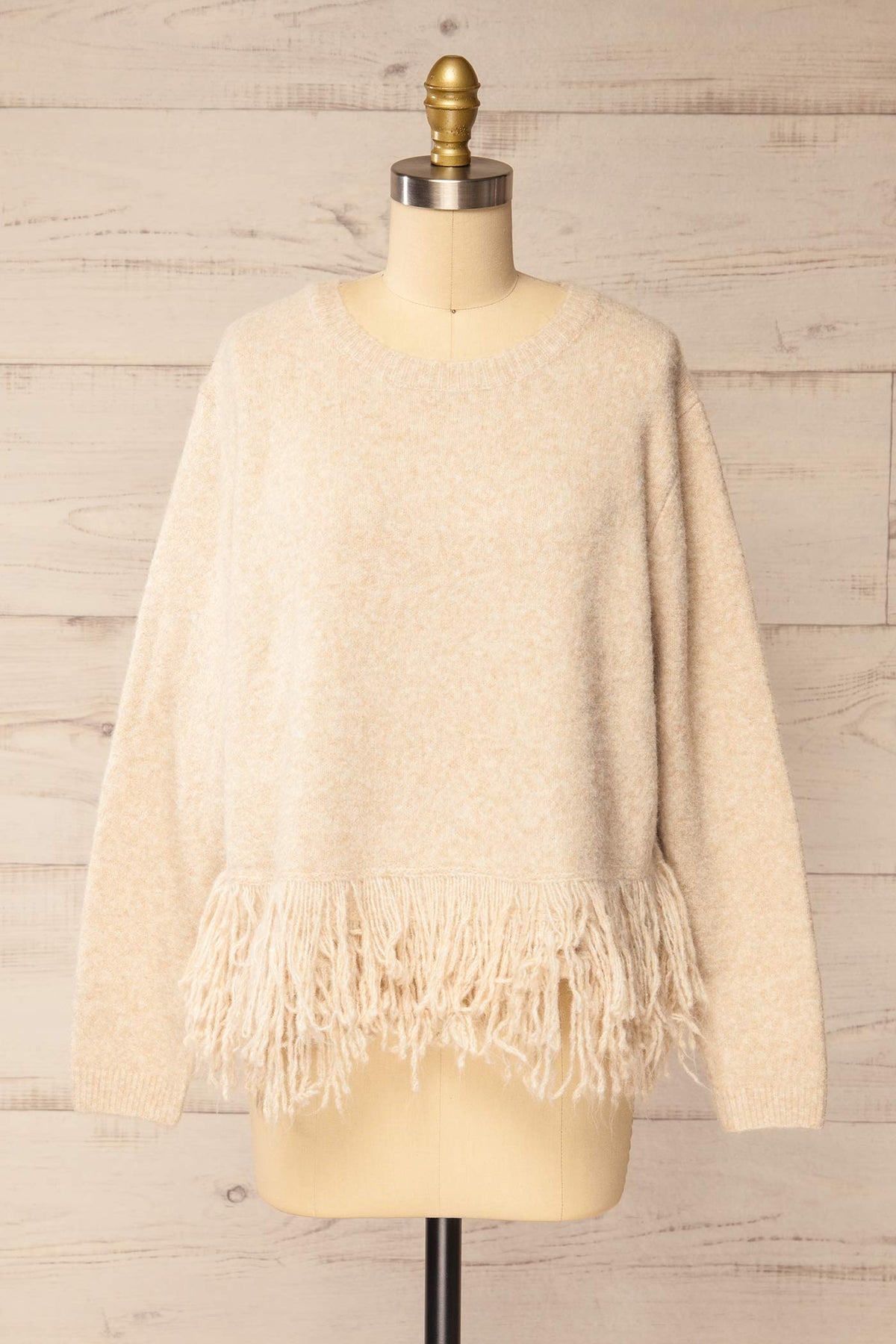 front view of Nachvak Beige Fringe Hem Crew Neck Knit Sweater at La petite garçonne