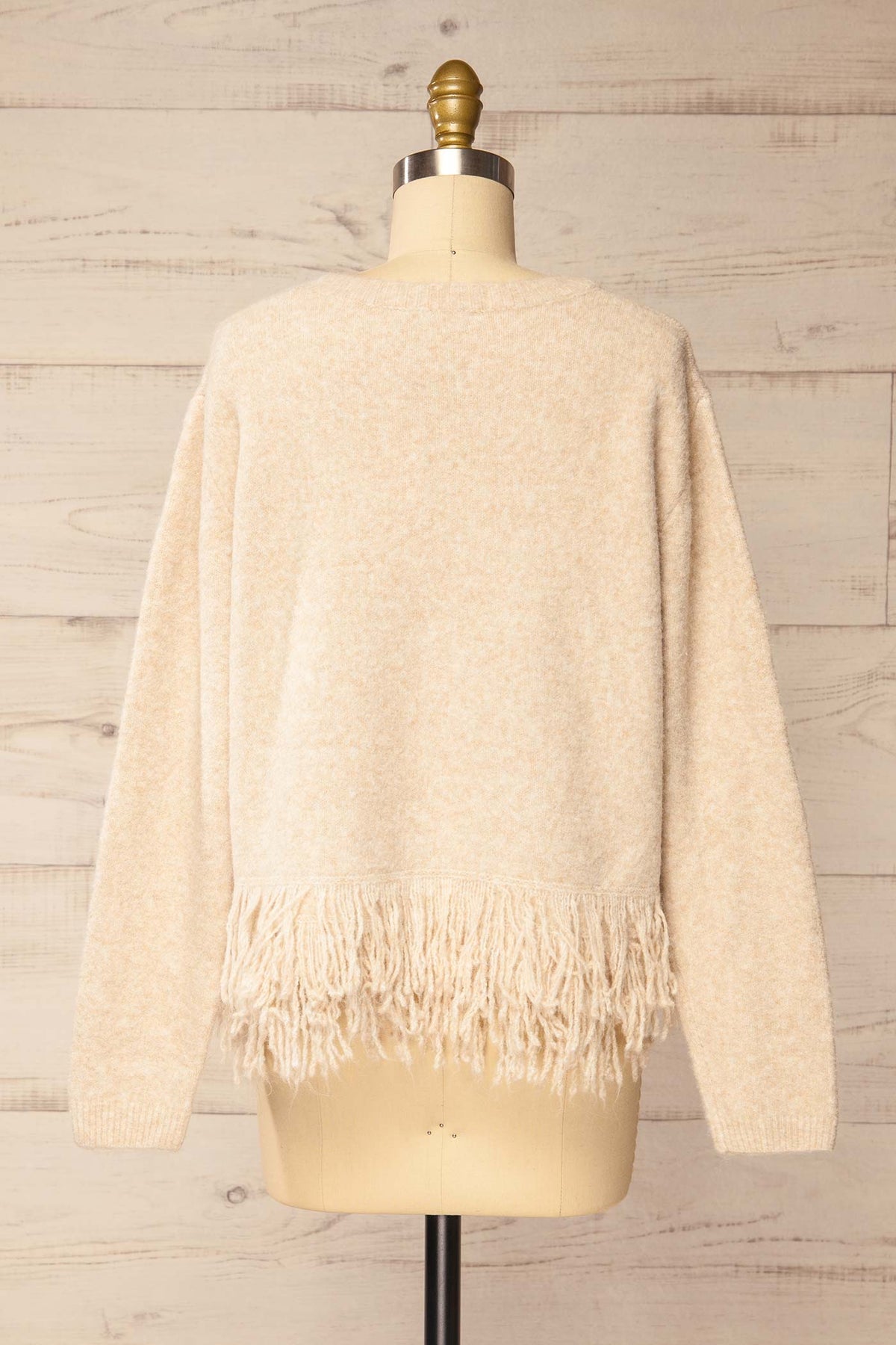 back view of Nachvak Beige Fringe Hem Crew Neck Knit Sweater at La petite garçonne
