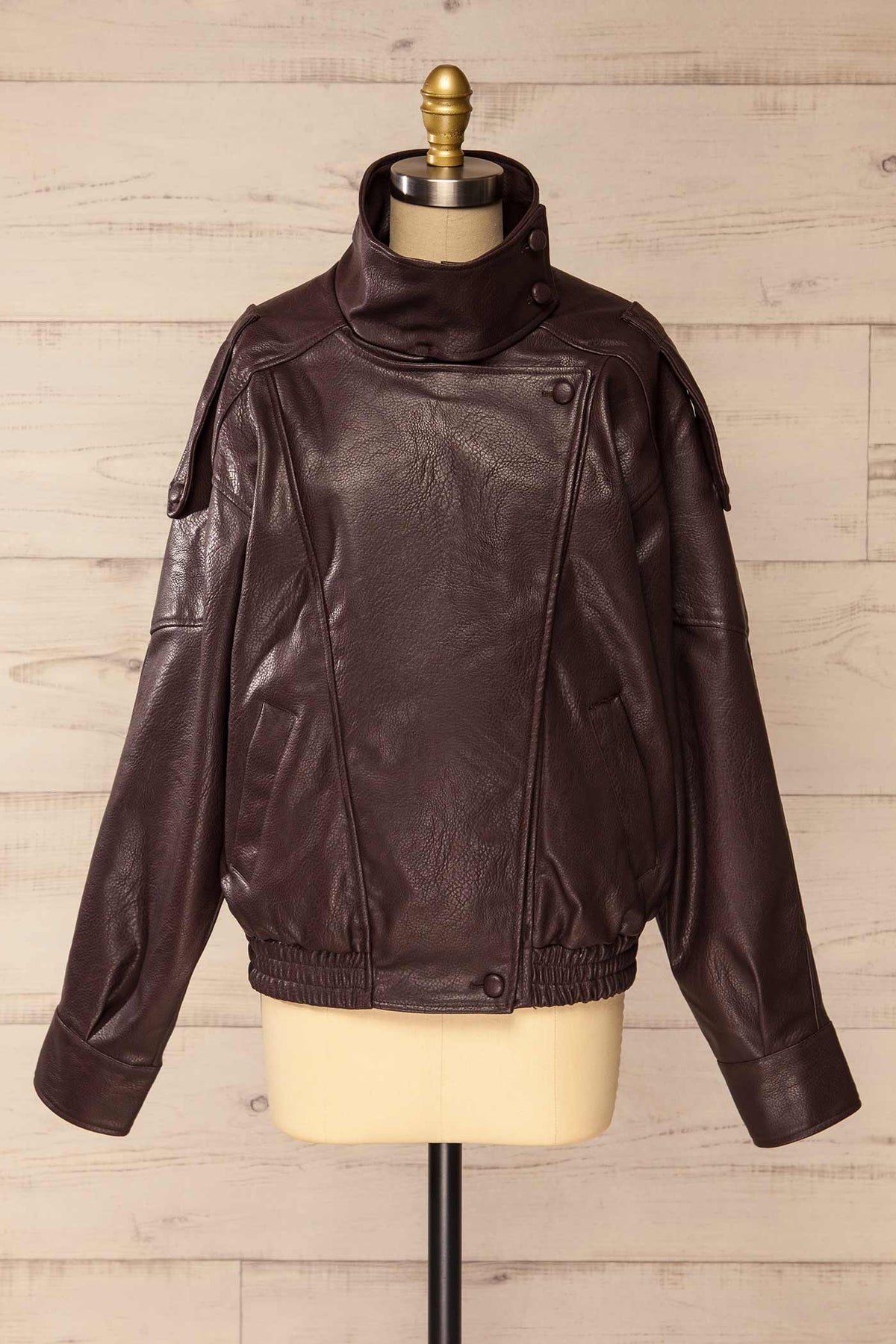 front view of Navarrenx Brown Faux Leather High Collar Jacket at La petite garçonne