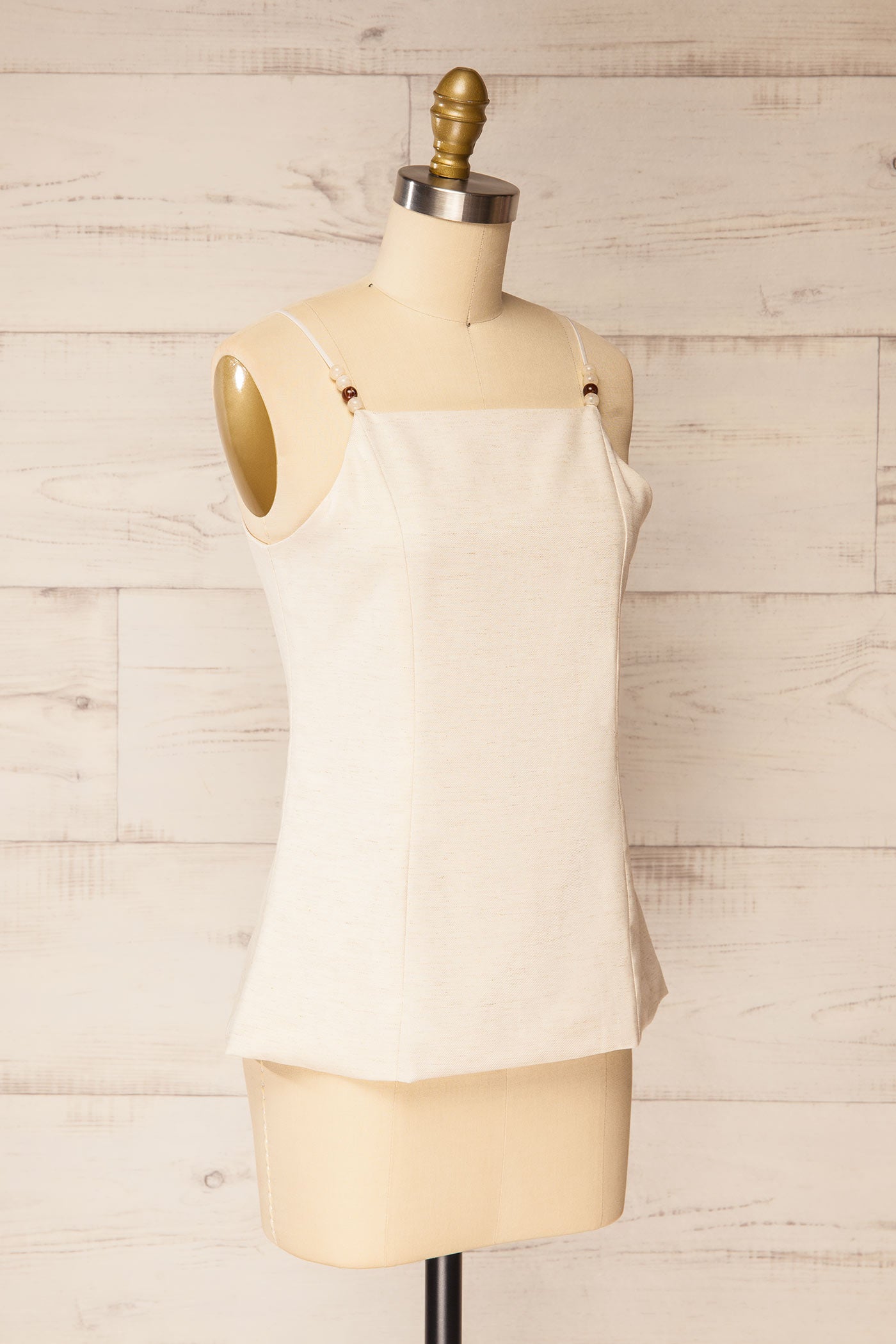 Sideview of Nikkita beige Beaded Strap Square-Neck Camisole at la petite garçonne