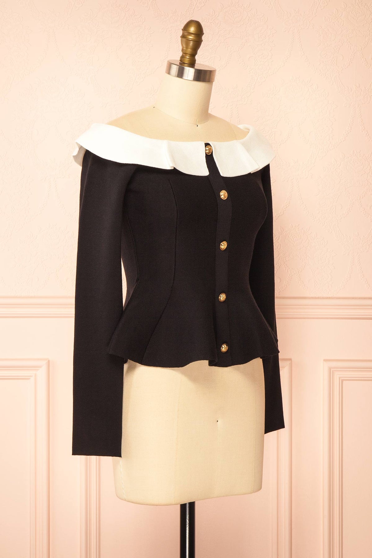 side view of Nuuk Black Off-the-Shoulder Peplum Top at Boutique 1861