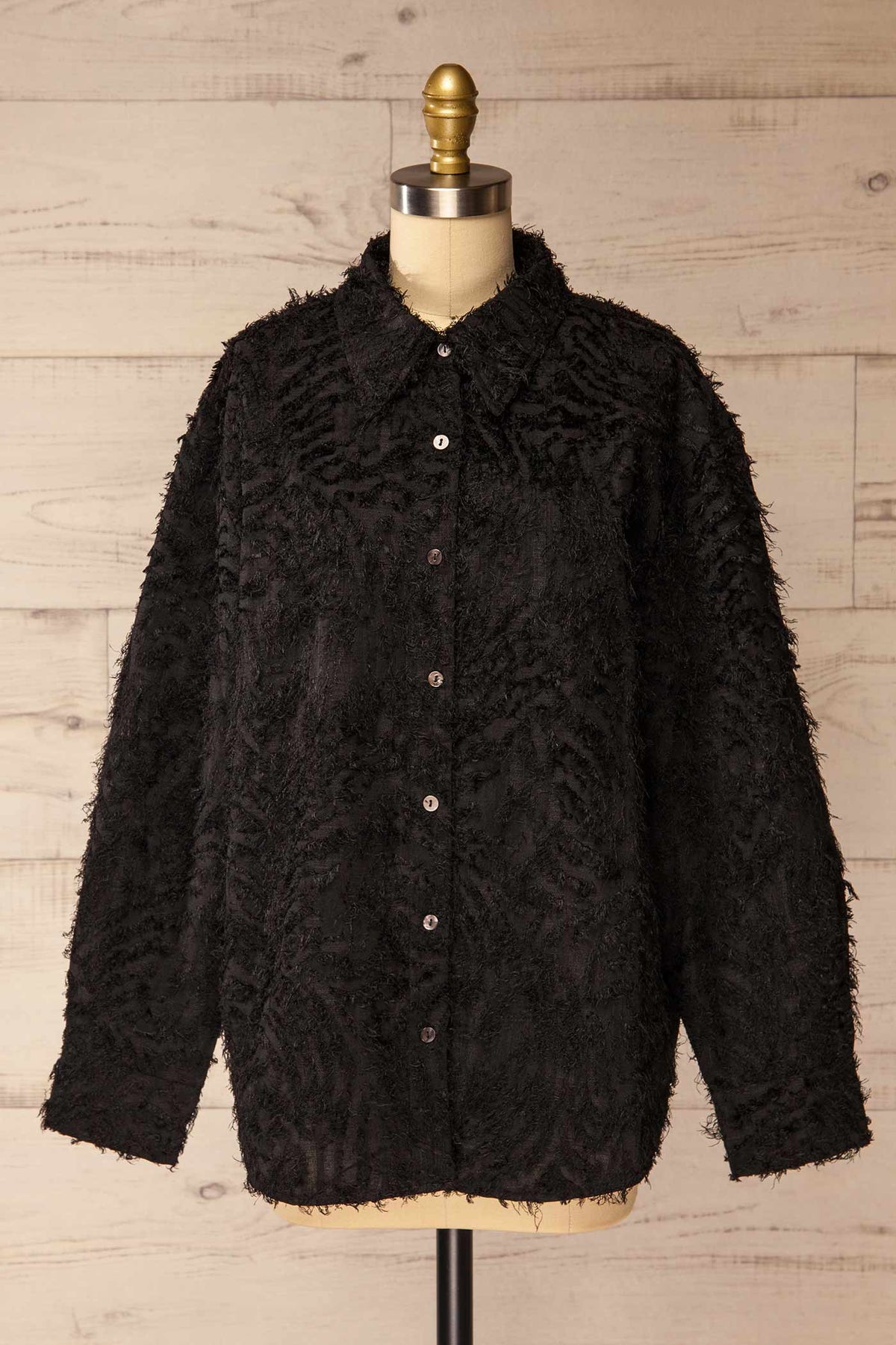 front view of Ostrovnoye Black Textured Fringe Long Sleeve Button-Down Shirt at La petite garçonne