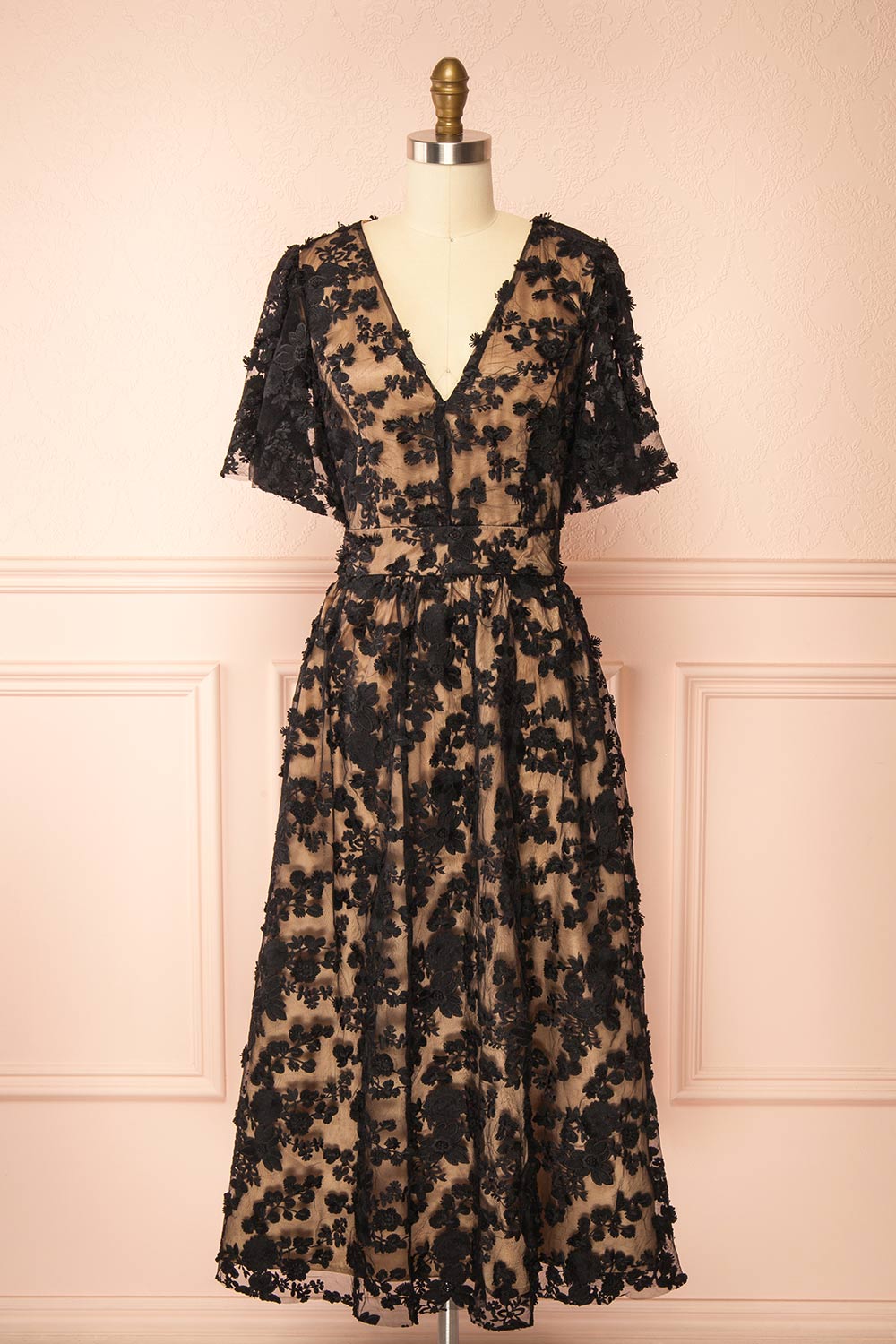front view of a Mannequin wearing the Oukie Black Midi Floral Lace Dress from boutique 1861