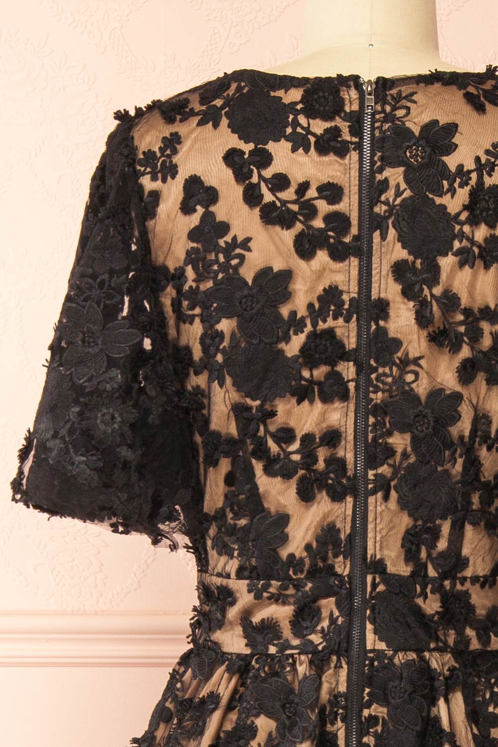back of a Mannequin wearing the Oukie Black Midi Floral Lace Dress from boutique 1861