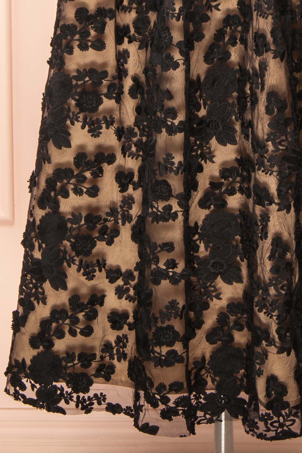 bottom of a Mannequin wearing the Oukie Black Midi Floral Lace Dress from boutique 1861