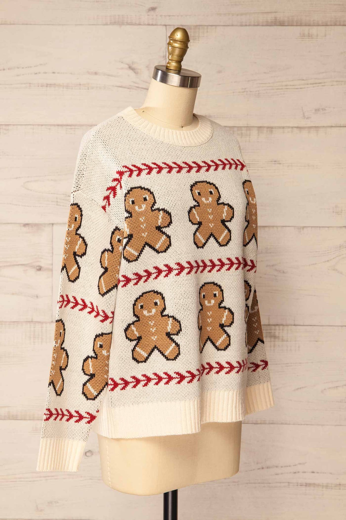 side view of Persia Ivory Gingerbread Pattern Knit Holiday Sweater at La petite garçonne