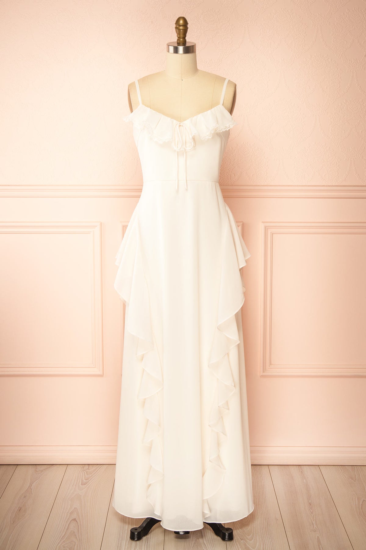 side view of Petria Ivory Ruffled Accent Sleeveless Maxi Dress with Front Tie at Boutique 1861