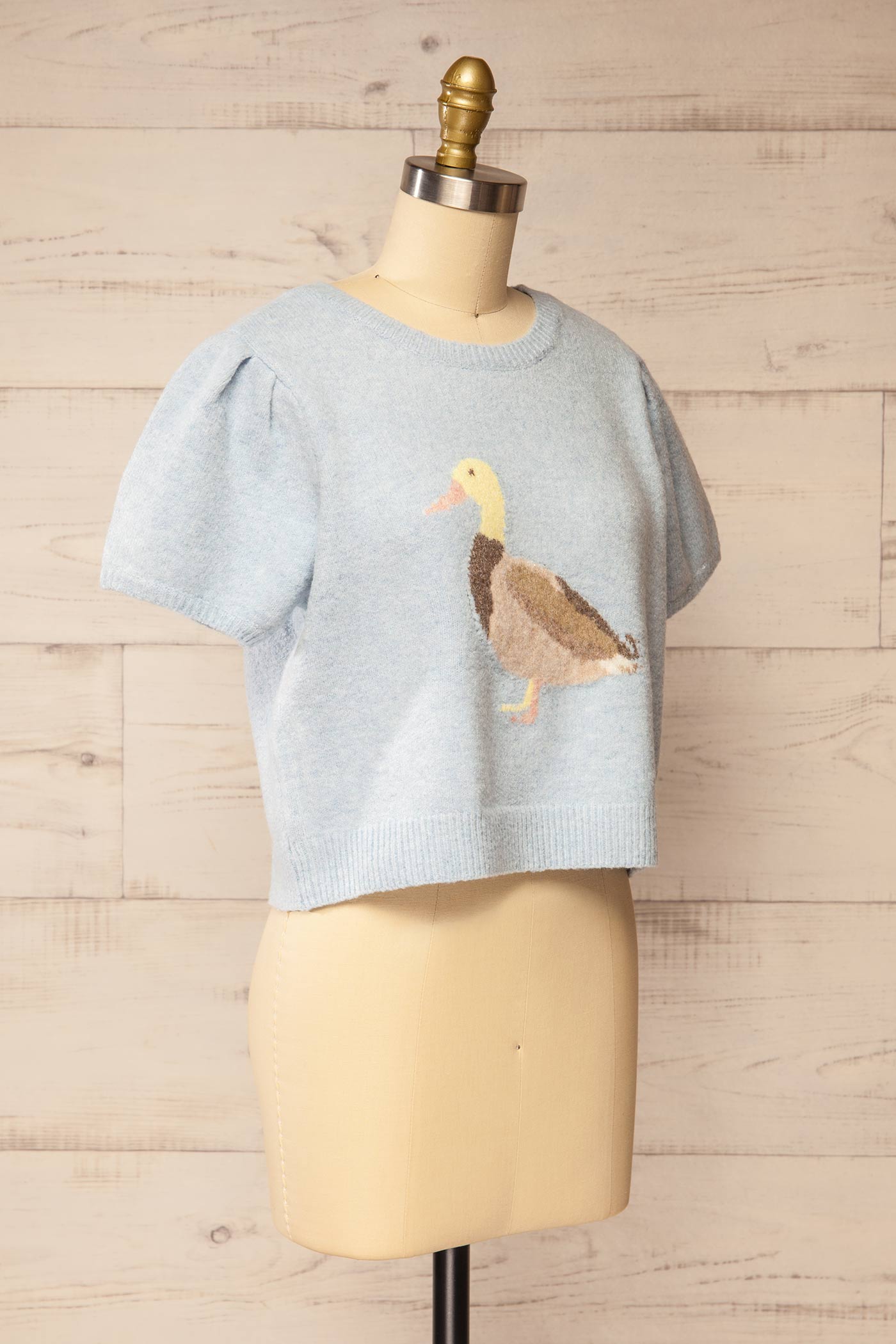 side view of Pokhodsk Blue Duck Graphic Short Puff Sleeve Knit Sweater at La petite garçonne
