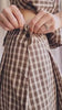 Person wearing Carince Brown Plaid Button Down Vest and skirt from La petite garçonne 