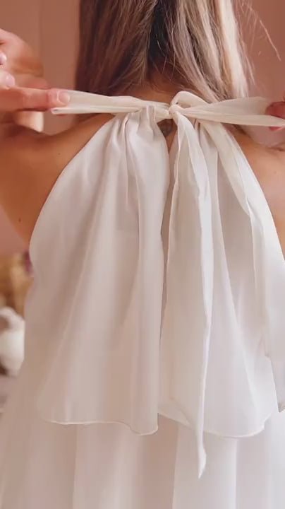 Woman wearing Khawla Ivory Tiered Short Organza Dress from Boudoir 1861