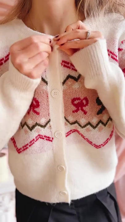 Video of a woman wearing Vaelienne Fuzzy Christmas Cardigan from Boutique 1861