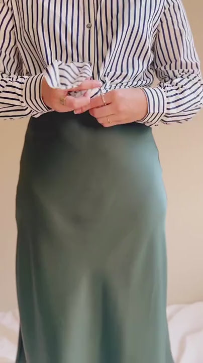 video Model wearing the blue and white striped shirt Safire 