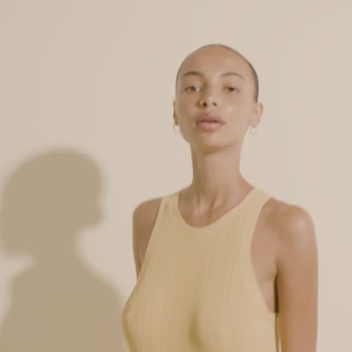 video of a woman wearing Ebna silver from Pilgrim, a gold hoop earring with stones details