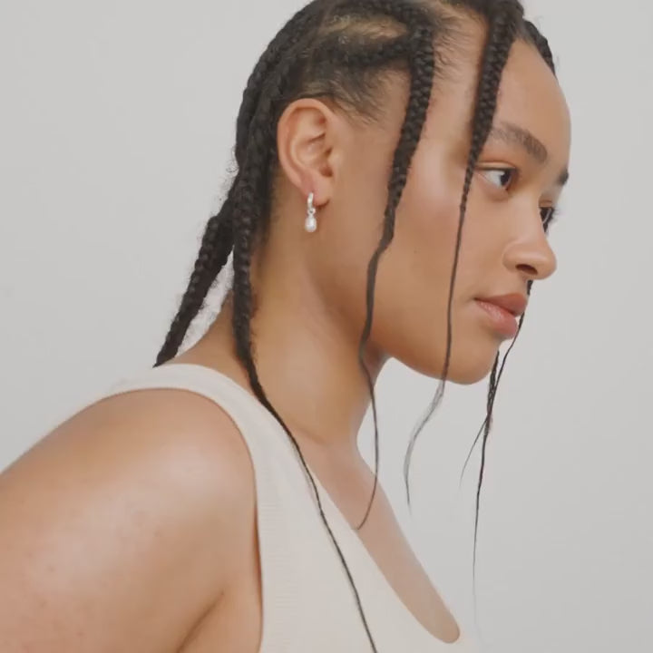 video of a Woman with braided hair wearing a Silver hoop earrings  Labasa by Pilgrim available at la petite garçonne
