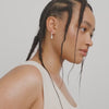 video of a Woman with braided hair wearing a Silver hoop earrings  Labasa by Pilgrim available at la petite garçonne